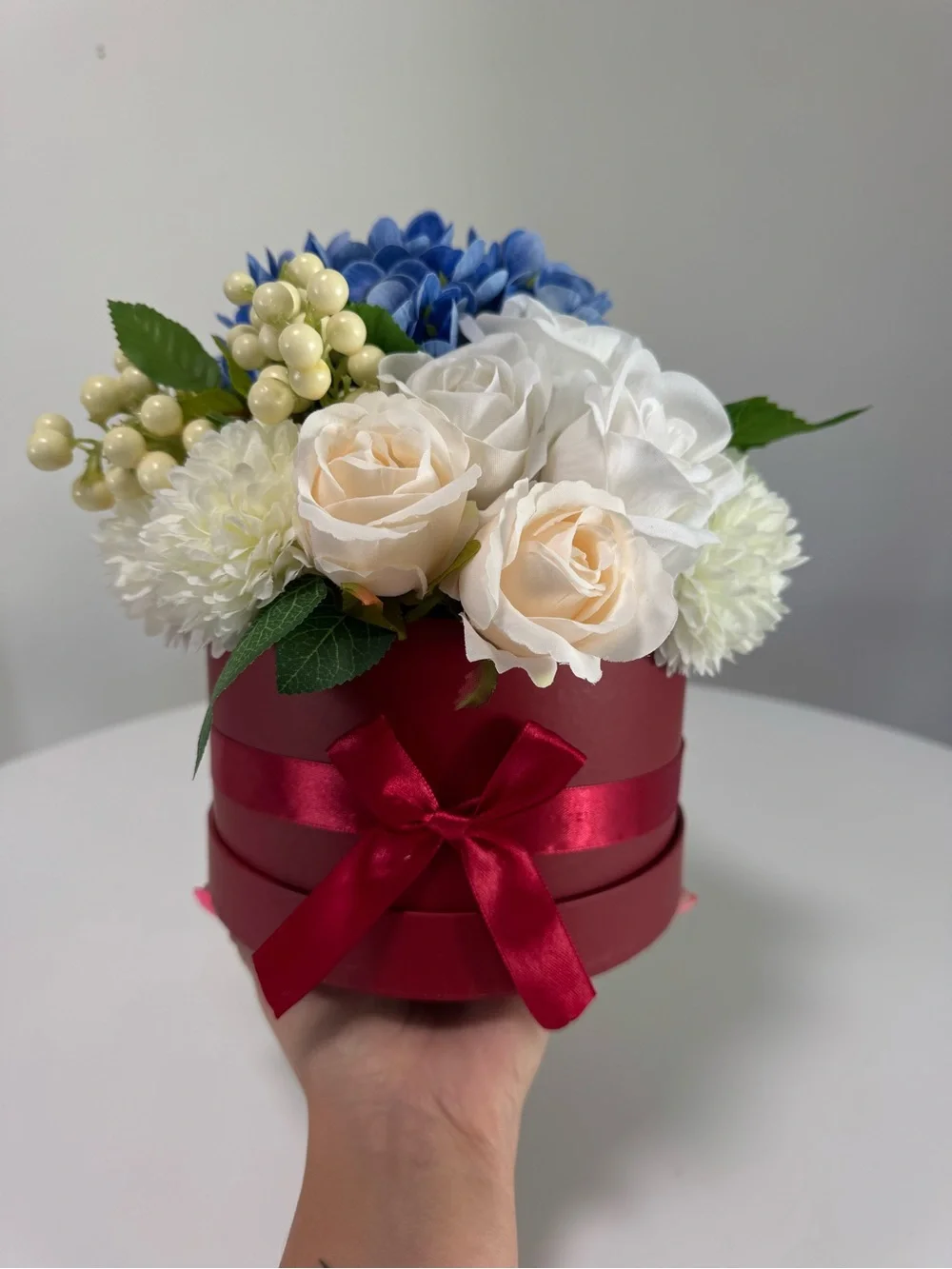 Artificial Floral Arrangement in Blue and Cream with Red Box